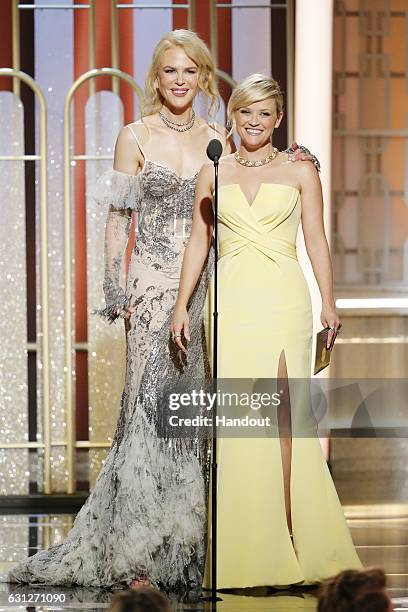 In this handout photo provided by NBCUniversal, presenters Nicole Kidman and Reese Witherspoon onstage during the 74th Annual Golden Globe Awards at...