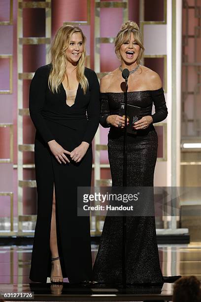 In this handout photo provided by NBCUniversal, presenters Amy Schumer and Goldie Hawn onstage during the 74th Annual Golden Globe Awards at The...