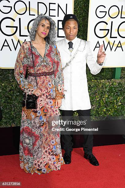 Creative director Mimi Valdes and musician Pharrell Williams attend 74th Annual Golden Globe Awards held at The Beverly Hilton Hotel on January 8,...