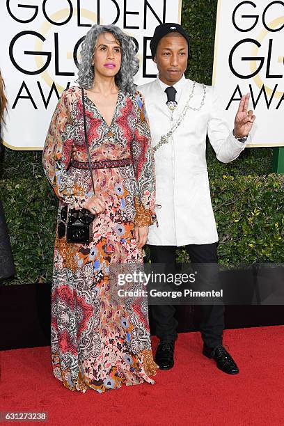 Creative director Mimi Valdes and musician Pharrell Williams attend 74th Annual Golden Globe Awards held at The Beverly Hilton Hotel on January 8,...