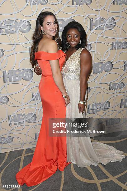Gymnasts Aly Raisman and Simone Biles attend HBO's Official Golden Globe Awards After Party at Circa 55 Restaurant on January 8, 2017 in Beverly...