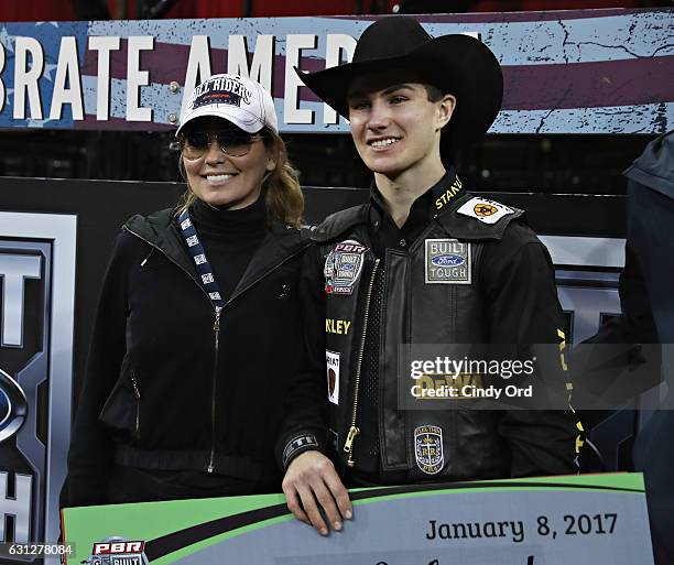 Singer Shania Twain poses with winner Jess Lockwood during the 2017 Professional Bull Riders Monster Energy Buck Off At The Garden at Madison Square...