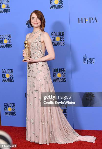 Actress Emma Stone, winner of Best Actress in a Motion Picture - Musical or Comedy for 'La La Land,' poses in the press room during the 74th Annual...