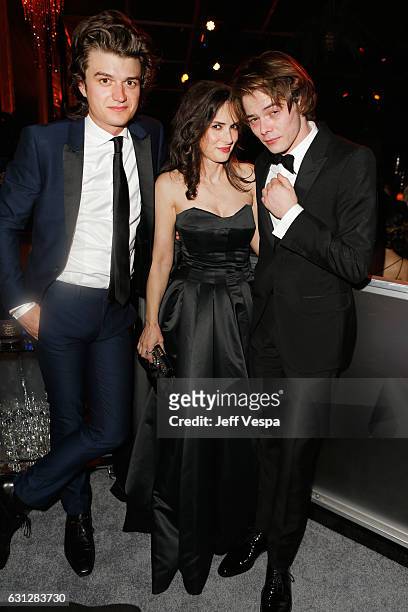 Actor Joe Keery, actress Winona Ryder and actor Charlie Heaton attend The Weinstein Company and Netflix Golden Globe Party, presented with FIJI...
