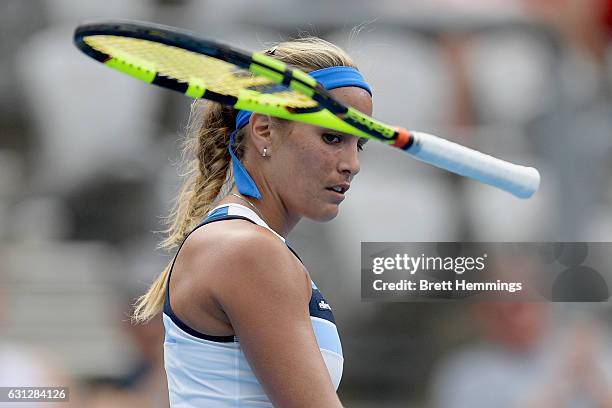 Monica Puig of Puerto Rico throws her racquet in her first round match against Caroline Wozniacki of Denmark during day two of the 2017 Sydney...