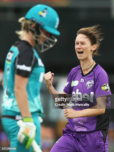 Julie Hunter of the Hurricances celebrates taking the wicket of Beth Mooney of the Heat during the Women's Big Bash League match between the Brisbane...