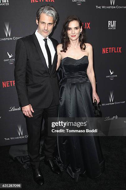 Scott Mackinlay Hahn and actress Winona Ryder attend The Weinstein Company and Netflix Golden Globe Party, presented with FIJI Water, Grey Goose...