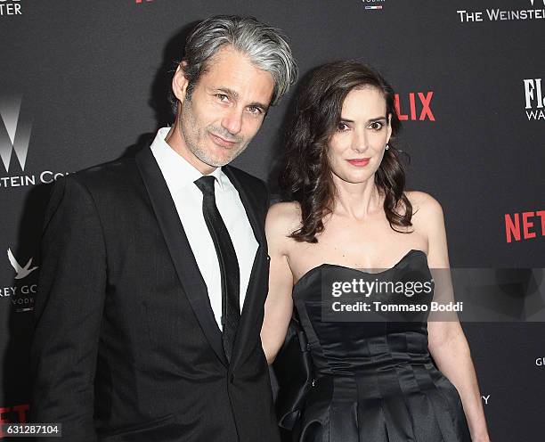 Scott Mackinlay Hahn and actress Winona Ryder attend The Weinstein Company and Netflix Golden Globe Party, presented with FIJI Water, Grey Goose...