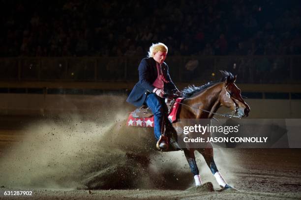 Guy Vernon dressed up in a Donald Trump mask, and riding Outwestkid, competes during the $20,000 RAM Invitational Freestyle Reining competition at...