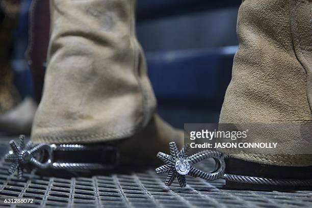 Mexican charro wearing a pair of ornate spurs, waits to compete in the final round of bareback riding during the 23rd Annual Mexican Rodeo...