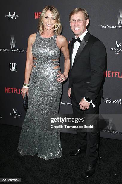 Former Olympic gymnasts Nadia Comaneci and Bart Conner attend The Weinstein Company and Netflix Golden Globe Party, presented with FIJI Water, Grey...