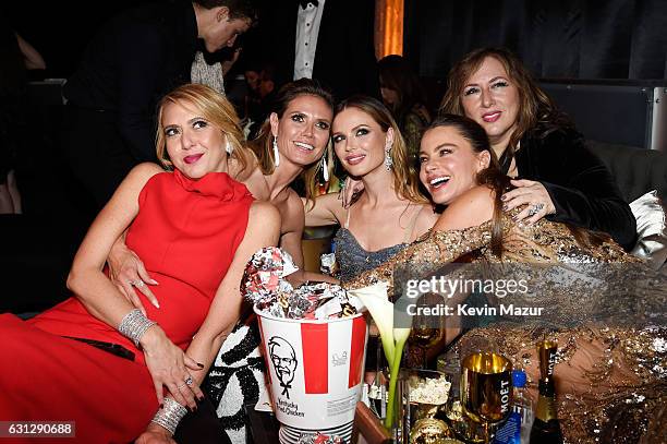 Personality Heidi Klum, designer Georgina Chapman and actress Sofia Vergara pose with guests at The Weinstein Company and Netflix Golden Globe Party,...