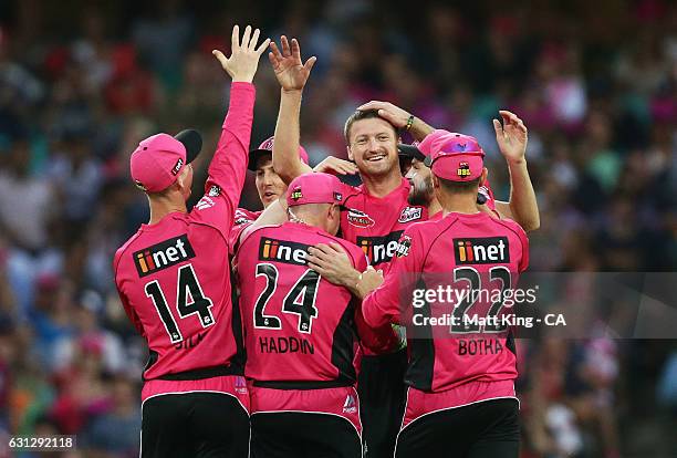 Jackson Bird of the Sixers celebrates with team mates after taking the wicket of Sunil Narine of the Renegades during the Big Bash League match...