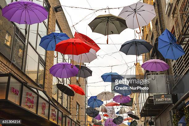 Umbrellas hang over Anne's Line, in Dublin city center. On Sunday, 8 January 2017, Dublin, Ireland.