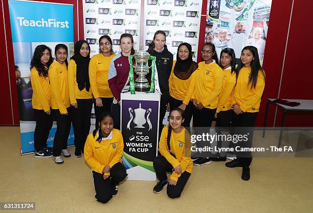 Beth Merrick of Aston Villa Ladies with pupils from Broadway Academy after the Women's FA Cup draw on January 9, 2017 in Birmingham, England.