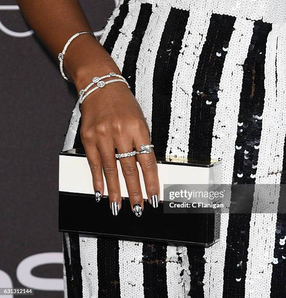Singer Janelle Monae, purse, jewelry and manicure detail, arrives at the 18th Annual Post-Golden Globes Party hosted by Warner Bros. Pictures and...