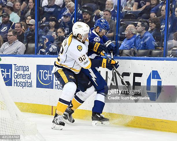 Nashville Predators center Ryan Johansen and Tampa Bay Lightning defender Anton Stralman battle behind the Lightning goal during the third period of...