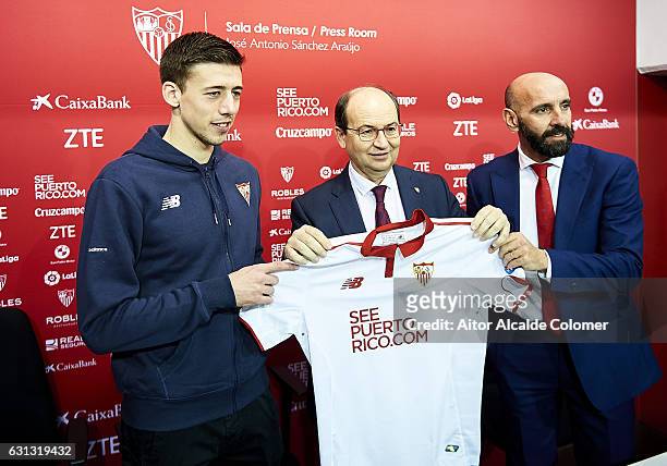 Clement Lenglet of Sevilla FC, president of Sevilla FC Jose Castro and sport director of Sevilla FC Ramon Rodriguez "Monchi" attends the press...