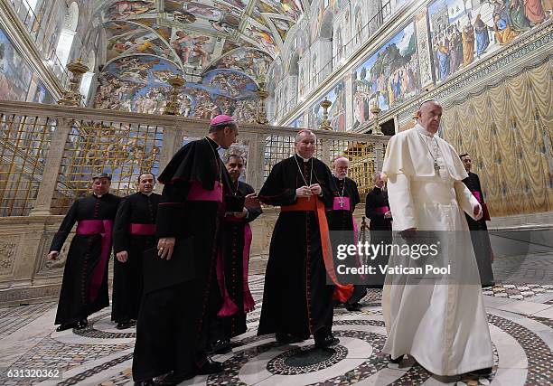 Pope Francis leaves after he poses with the accredited ambassadors to the Holy See at the Sistine Chapel 'Cappella Sistina' on January 9, 2017 in...