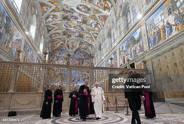 Pope Francis leaves after he poses with the accredited ambassadors to the Holy See at the Sistine Chapel 'Cappella Sistina' on January 9, 2017 in...