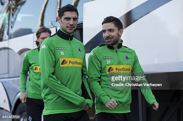 Lars Stindl and Julian Korb arrive at the trainings pitch ahead a Training Session at Borussia Moenchengladbach Training Camp on January 09, 2017 in...