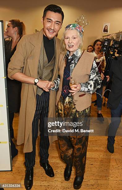 Hu Bing and Dame Vivienne Westwood pose backstage at the Vivienne Westwood show during London Fashion Week Men's January 2017 collections at Seymour...