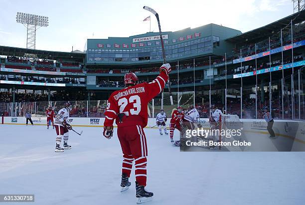 Boston University's Jakob Forsbacka Karlsson celebrates a goal against UMass during the first period of play at Fenway Park in Boston on Jan. 8, 2017.