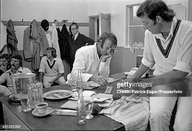 Doug Walters of Australia plays cribbage with team-mate Rick McCosker in the Australian dressing room during the 1st Test match between England and...