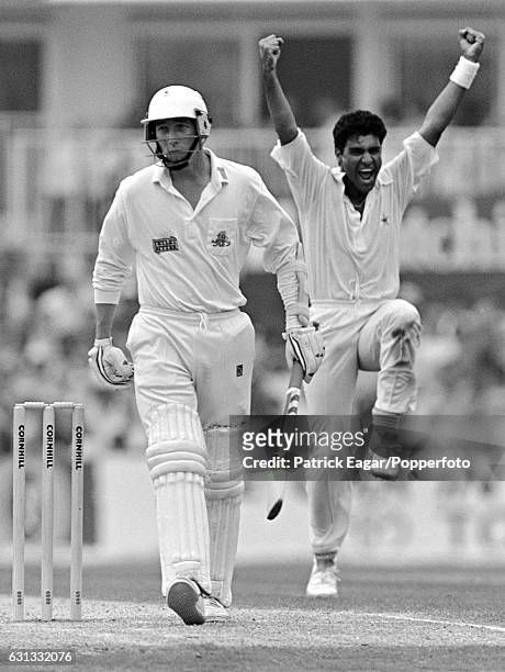 Waqar Younis of Pakistan celebrates after dismissing England batsman Mike Atherton for 4 runs during the 5th Test match between England and Pakistan...