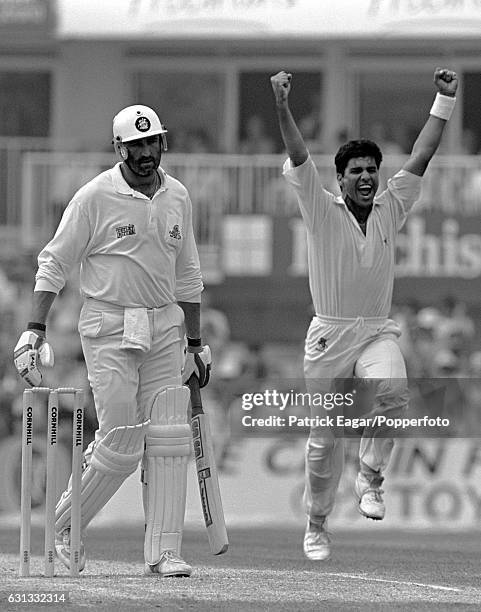 Waqar Younis of Pakistan celebrates after dismissing England batsman Graham Gooch for 24 runs during the 5th Test match between England and Pakistan...