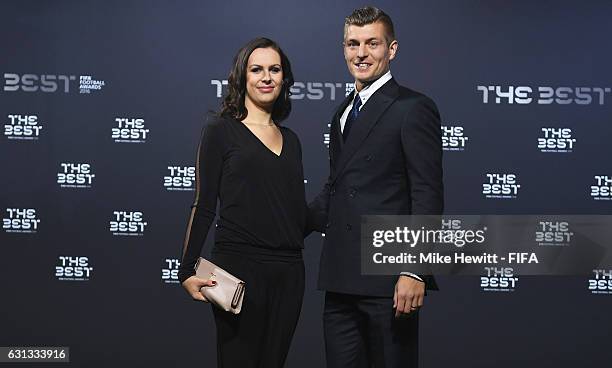 Toni Kroos of Germany and Real Madrid and his wife Jessica Farber pose as they arrive for The Best FIFA Football Awards at TPC Studio on January 9,...