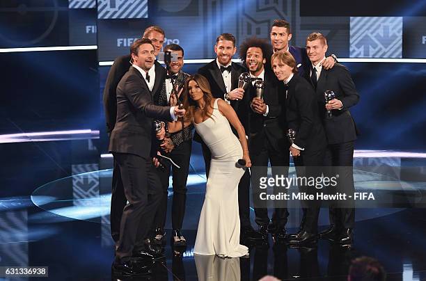 Members of the FIFA FIFPro World11 pose on stage with hosts Eva Longoria and Marco Schreyl during The Best FIFA Football Awards at TPC Studio on...