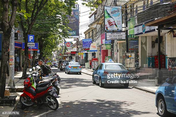 Typical street with taxis on January 05, 2016 in Kuta, Bali, Indonesia.