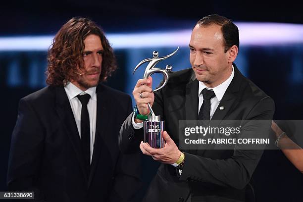 Colombian executive and chairman of Atletico Nacional Juan Carlos de la Cuesta holds The 2016 FIFA Fair Play Award next to former Spanish football...