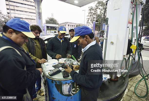 Petrol pumps accepting payment through debit and credit cards on January 9, 2017 in New Delhi, India. Government cleared that credit and debit cards...