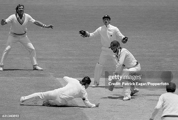 England fielder Allan Lamb at silly point dives to make an attempted catch off Steve Waugh of Australia during the 2nd Test match between Australia...