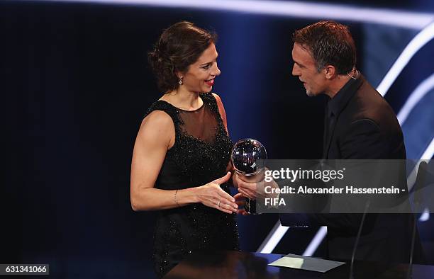 Carli Lloyd of the United States and Houston Dash accepts The Best FIFA Women's Player Award from Gabriel Batistuta of Argentina during The Best FIFA...