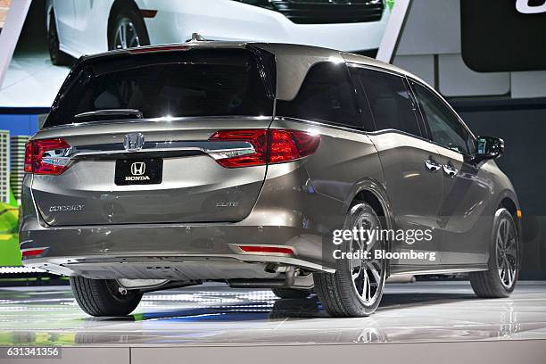 The 2018 Honda Motor Co. Odyssey minivan vehicle sits on display during the 2017 North American International Auto Show in Detroit, Michigan, U.S.,...