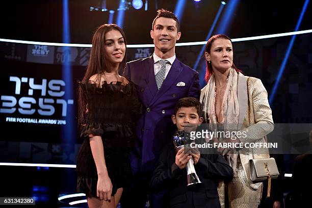 Real Madrid and Portugal's forward and winner of The Best FIFA Mens Player of 2016 Award Cristiano Ronaldo poses with partner Georgina Rodriguez ,...