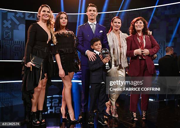 Real Madrid and Portugal's forward and winner of The Best FIFA Mens Player of 2016 Award Cristiano Ronaldo poses with partner Georgina Rodriguez ,...