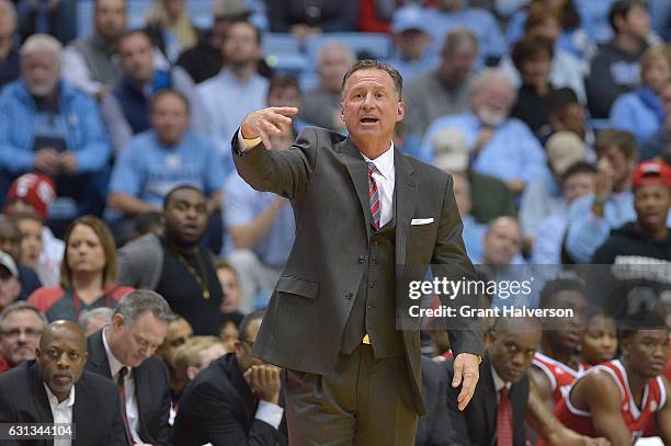 Head coach Mark Gottfried of the North Carolina State Wolfpack directs his team against the North Carolina Tar Heels during the game at the Dean...