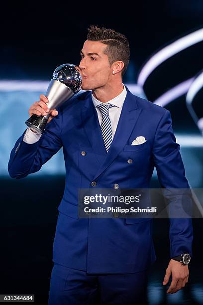 The Best FIFA Men's Player Award winner Cristiano Ronaldo of Portugal and Real Madrid kisses the trophy during The Best FIFA Football Awards 2016 on...