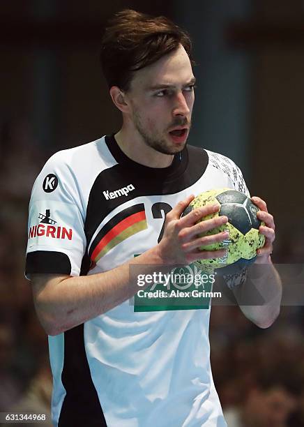 Patrick Groetzki of Germany controles the ball during the international handball friendly match between Germany and Austria at Rothenbach-Halle on...