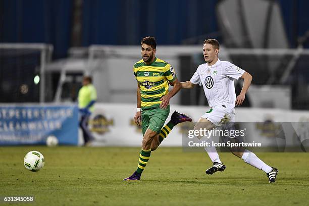 Tampa Bay Rowdies forward Jaime Siaj tries to beat Vfl Wolfsburg defender Paul Jaeckel to a through pass during the second half of a Florida Cup...