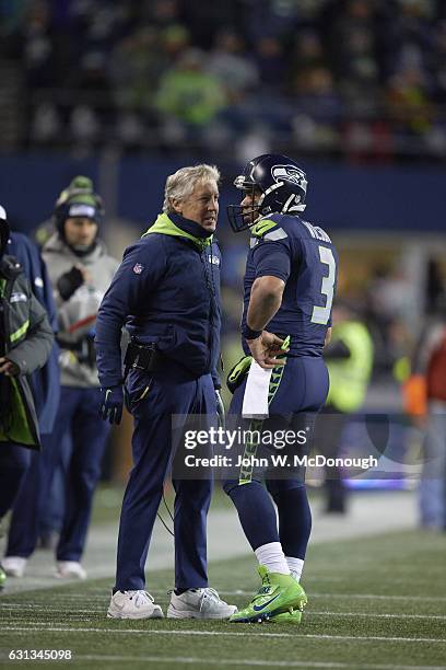 Playoffs: Seattle Seahawks QB Russell Wilson with coach Pete Carroll during game vs Detroit Lions at CenturyLink Field. Seattle, WA 1/7/2017 CREDIT:...