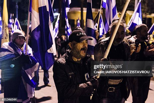 Members and supporters of the Greek Cypriot far-right National Popular Front shout slogans during a protest against peace talks between rival Cypriot...