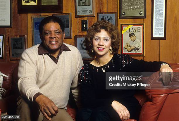 Closeup portrait of former baseball player Willie Mays posing with his wife Mae Louise Allen during photo shoot at home. San Francisco, CA 3/3/1985...