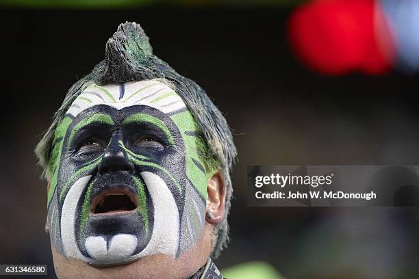 Playoffs: Closeup of face painted Seattle Seahawks fan during game vs Detroit Lions at CenturyLink Field. Seattle, WA 1/7/2017 CREDIT: John W....