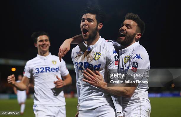 Alex Mowatt of Leeds United celebrates with team mates as he scores their second goal during the Emirates FA Cup Third Round match between Cambridge...