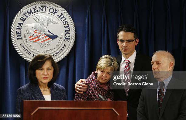 Mary Rizzo, center, the mother of Jonathan Rizzo, who was murdered by Gary Lee Sampson, is embraced by Prosecutor Zachary Hafer, second from right,...